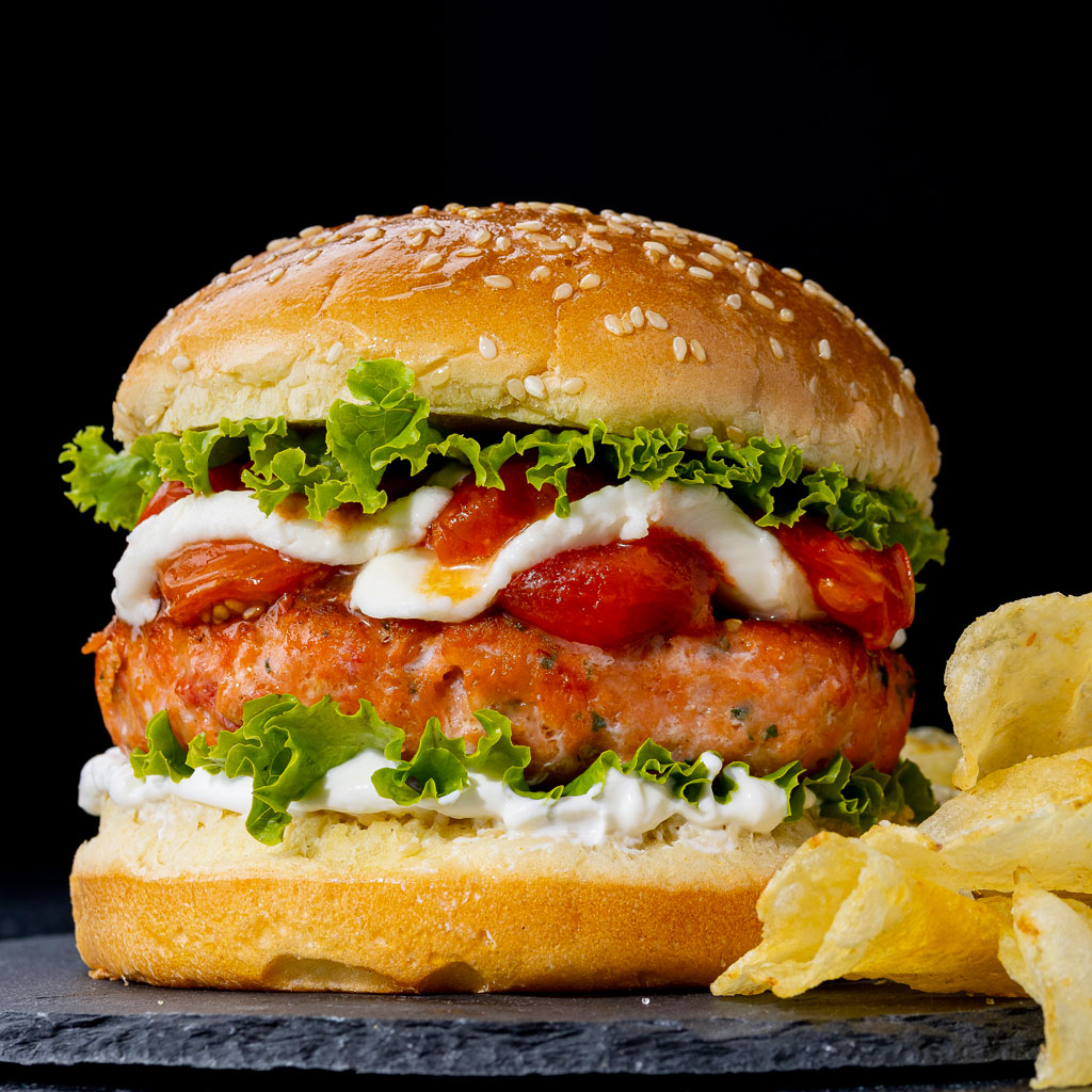 https://wildalaskasalmonandseafood.com/wp-content/uploads/2023/05/fire-roasted-tomato-salmon-burger-1.jpg